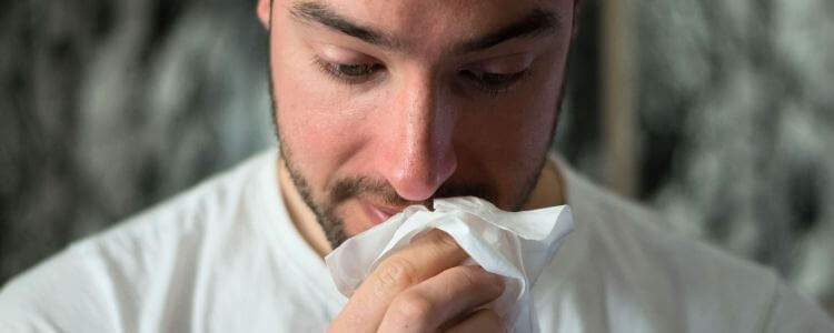 Man sniffling with Nasal polyps